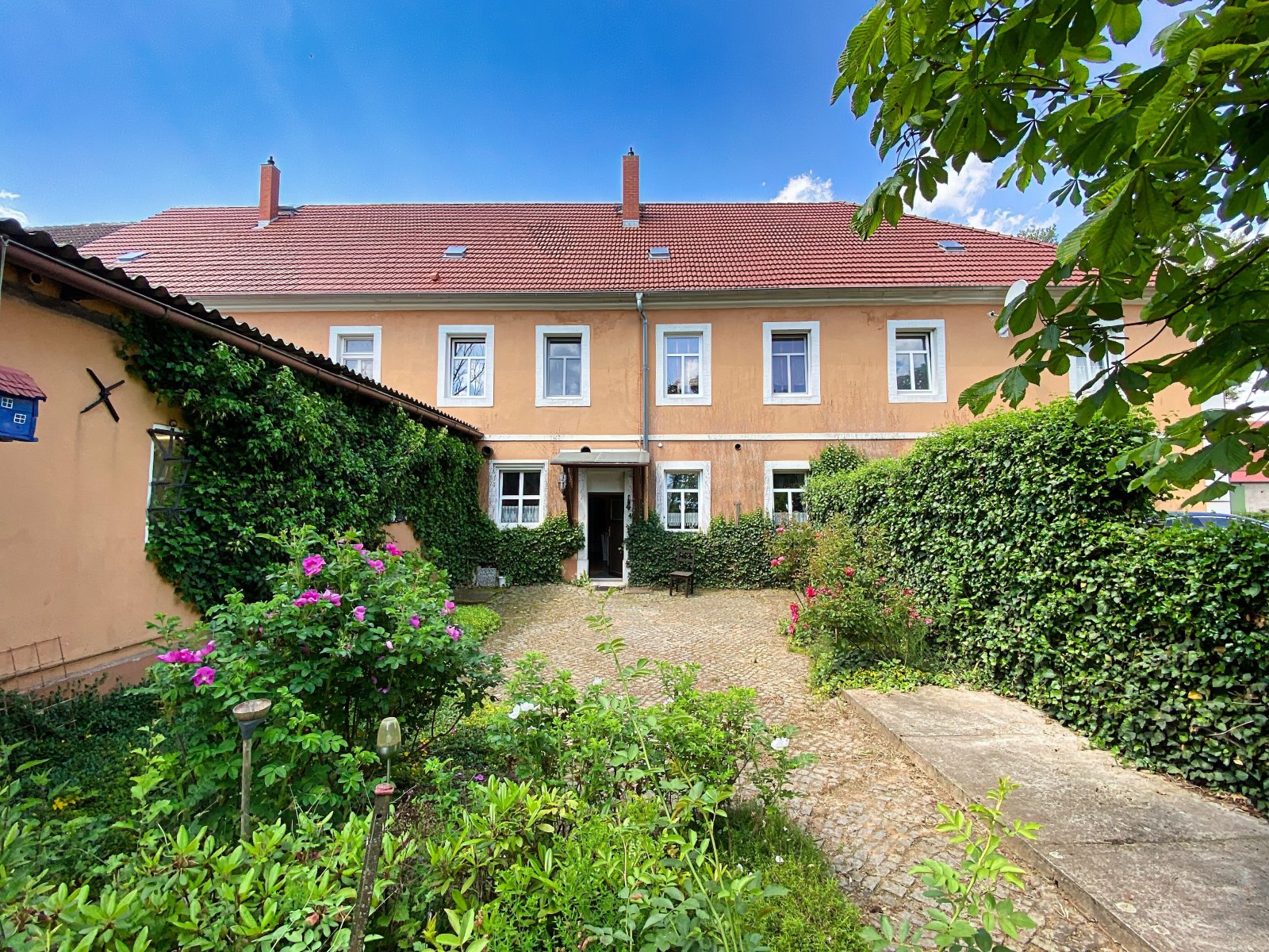 Haupthaus Rückseite Terrasse 2-Zi. Whg. Eigentümer